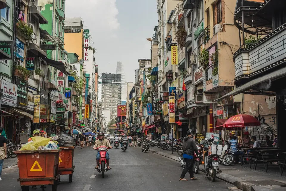 Motorbikes and people on a busy street in Ho Chi Minh City, Vietnam