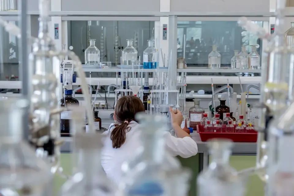 A technician running an analysis at a laboratory bench