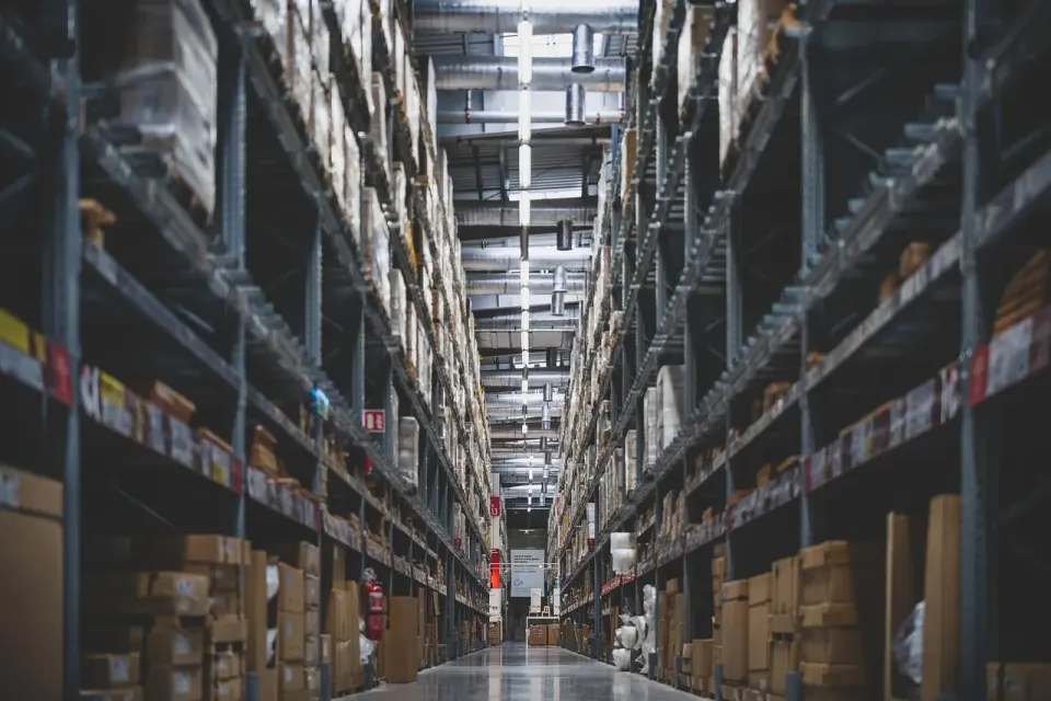 Boxed stock stacked on warehouse shelves